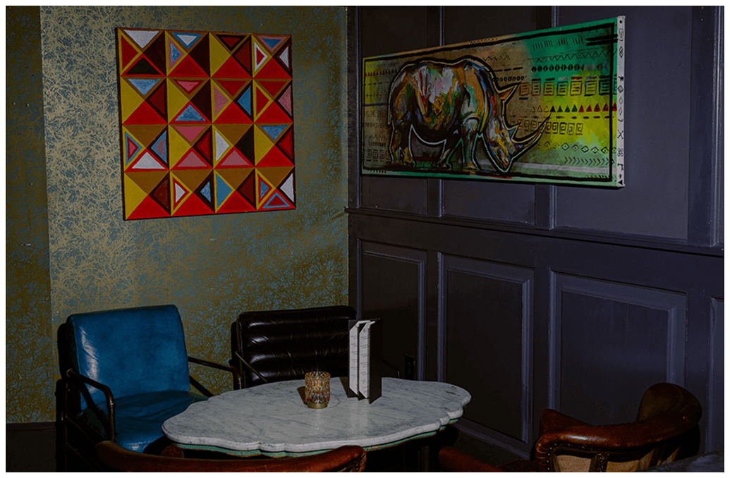 Marble table and leather chairs at The Haymaker